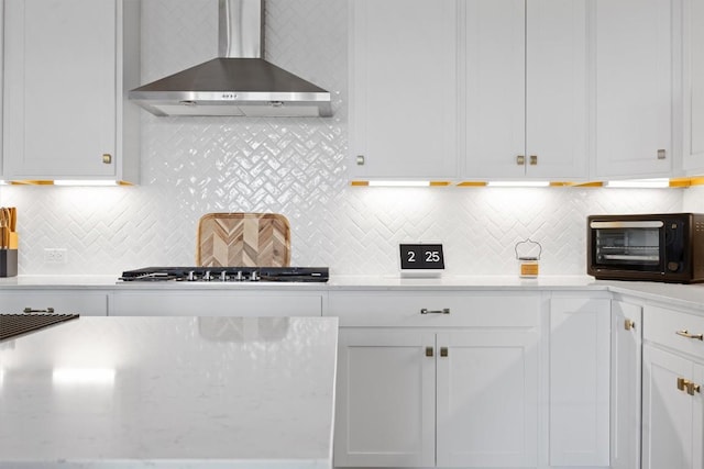 400 Turnbuckle Bnd, Leander, TX 78641 - kitchen featuring wall chimney range hood, white cabinets, and decorative backsplash