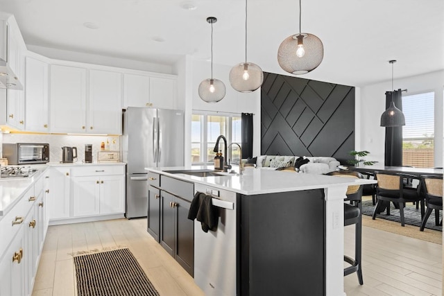 400 Turnbuckle Bnd, Leander, TX 78641 - kitchen featuring stainless steel appliances, light countertops, and white cabinets