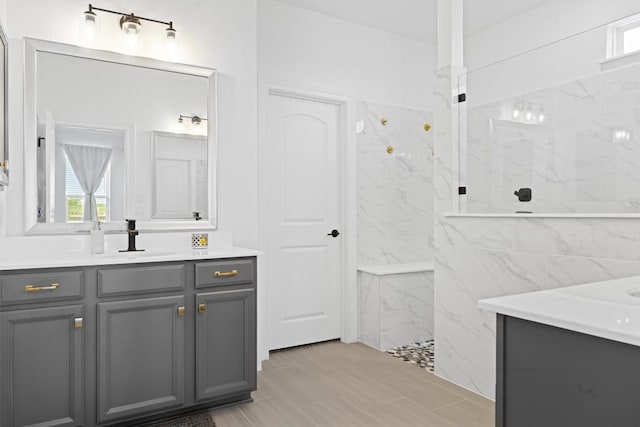 400 Turnbuckle Bnd, Leander, TX 78641 - bathroom featuring two vanities, a marble finish shower, and tile walls
