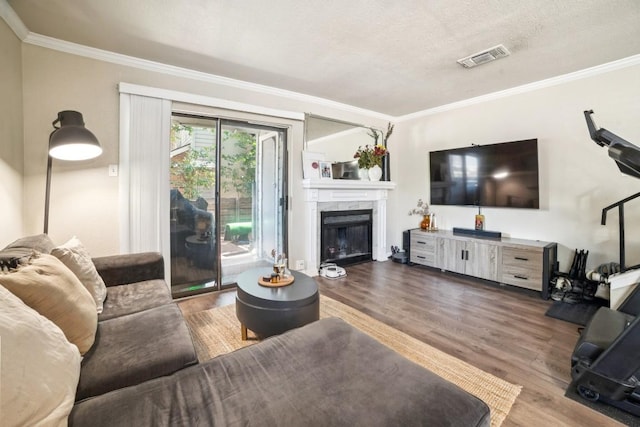 2018 W Rundberg Ln Unit 6A, Austin, TX 78758 - living room with crown molding, wood finished floors, and a fireplace