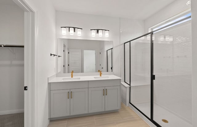 2725 Woodall Dr Unit 1601, Cedar Park, TX 78613 - bathroom featuring double vanity, a shower stall, and a walk in closet