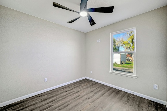 212 Walnut Ave, Luling, TX 78648 - empty room with wood finished floors and a ceiling fan