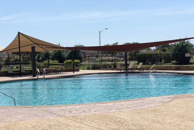 1224 Euless Ln, Leander, TX 78641 - community pool featuring a patio