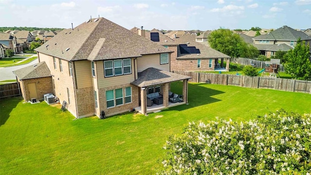 1224 Euless Ln, Leander, TX 78641 - back of property with a residential view, a shingled roof, a fenced backyard, and a patio area