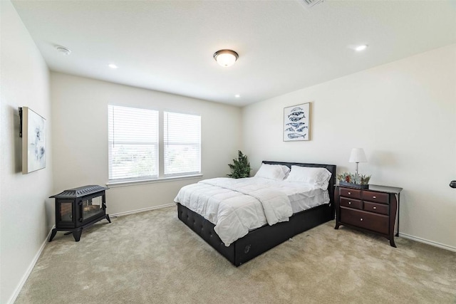 1224 Euless Ln, Leander, TX 78641 - carpeted bedroom featuring a wood stove and recessed lighting