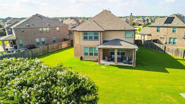 1224 Euless Ln, Leander, TX 78641 - back of house with a residential view, a patio, brick siding, a fenced backyard, and a shingled roof