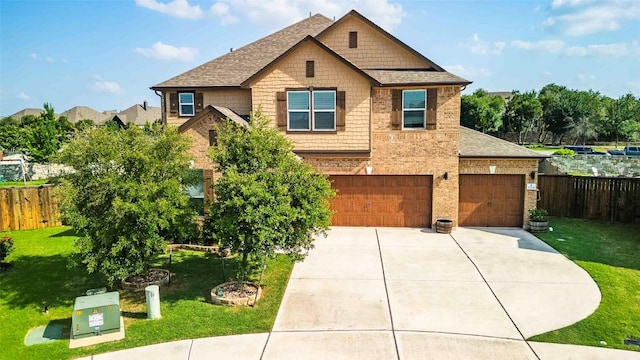 1224 Euless Ln, Leander, TX 78641 - craftsman inspired home featuring concrete driveway, a shingled roof, brick siding, and an attached garage