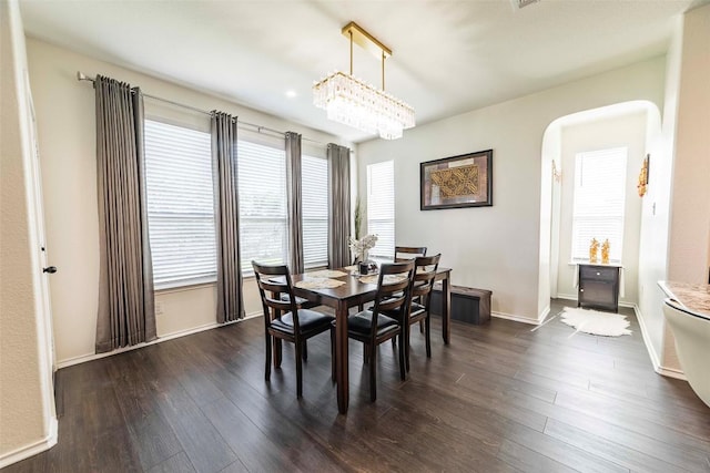 1224 Euless Ln, Leander, TX 78641 - dining room featuring arched walkways and dark wood-style flooring