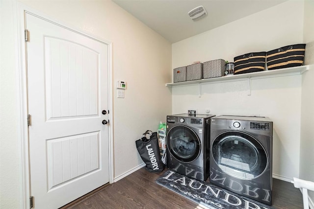 1224 Euless Ln, Leander, TX 78641 - washroom with dark wood-type flooring and washing machine and clothes dryer