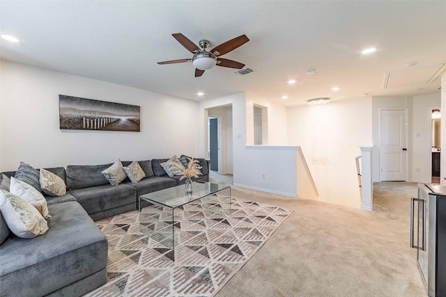 1224 Euless Ln, Leander, TX 78641 - living area featuring attic access, a ceiling fan, recessed lighting, light colored carpet, and wine cooler