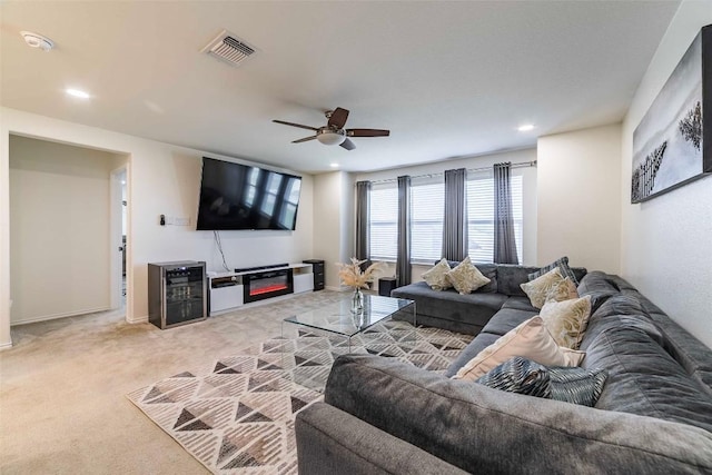 1224 Euless Ln, Leander, TX 78641 - living room with wine cooler, ceiling fan, light colored carpet, and recessed lighting