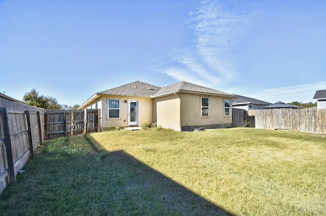 121 Talon Dr, Luling, TX 78648 - back of house with stucco siding
