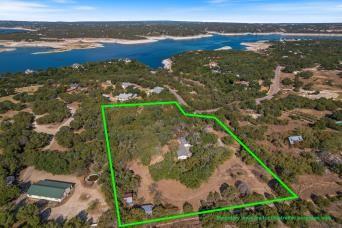 4605 Eck Ln, Austin, TX 78734 - aerial view of property and surrounding area featuring a large body of water and property parcel outlined