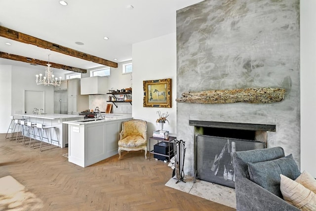 1700 S 6th St, Austin, TX 78704 - kitchen with a breakfast bar, light countertops, recessed lighting, a chandelier, and pendant lighting