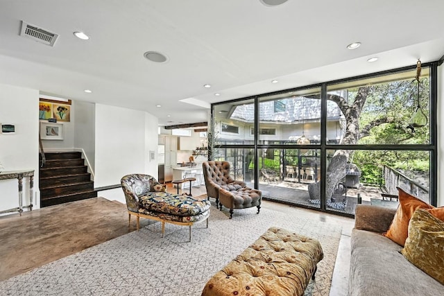 1700 S 6th St, Austin, TX 78704 - living room featuring expansive windows, stairs, and recessed lighting