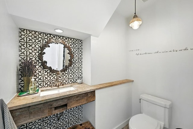 1700 S 6th St, Austin, TX 78704 - bathroom featuring toilet, vanity, and lofted ceiling