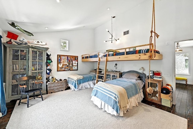1700 S 6th St, Austin, TX 78704 - bedroom with lofted ceiling and hardwood / wood-style floors