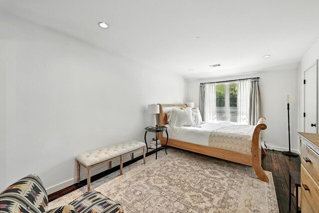 1700 S 6th St, Austin, TX 78704 - bedroom with wood finished floors, baseboards, and recessed lighting