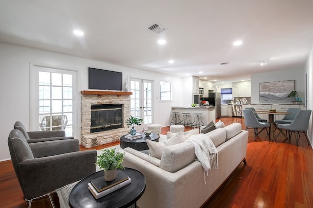 1005 Salem Ln, Austin, TX 78753 - living room with a fireplace, dark wood-style floors, and recessed lighting