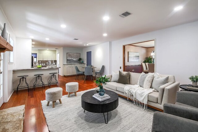 1005 Salem Ln, Austin, TX 78753 - living room featuring dark wood-style flooring and recessed lighting