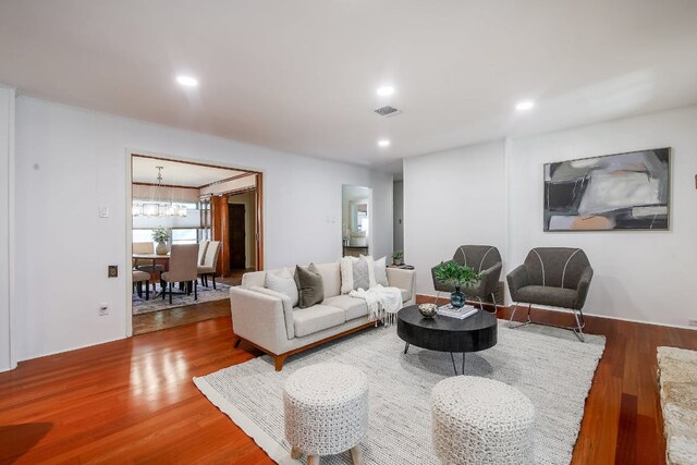 1005 Salem Ln, Austin, TX 78753 - living area with wood finished floors, a chandelier, and recessed lighting