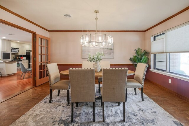 1005 Salem Ln, Austin, TX 78753 - dining space with a chandelier, baseboards, and ornamental molding