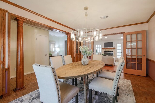 1005 Salem Ln, Austin, TX 78753 - dining space featuring a chandelier, decorative columns, and ornamental molding