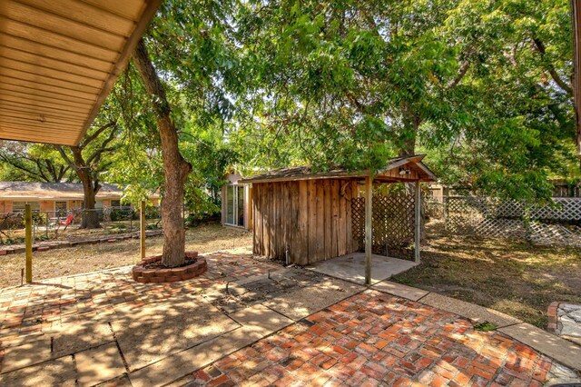 1005 Salem Ln, Austin, TX 78753 - fenced backyard featuring a patio area and an outbuilding