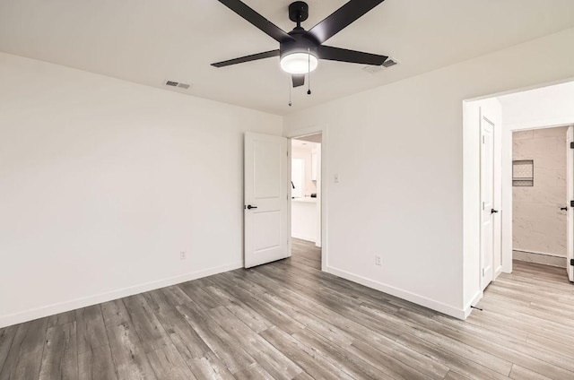 7103 Treasure Cv Unit B, Austin, TX 78745 - unfurnished bedroom with wood finished floors and ceiling fan