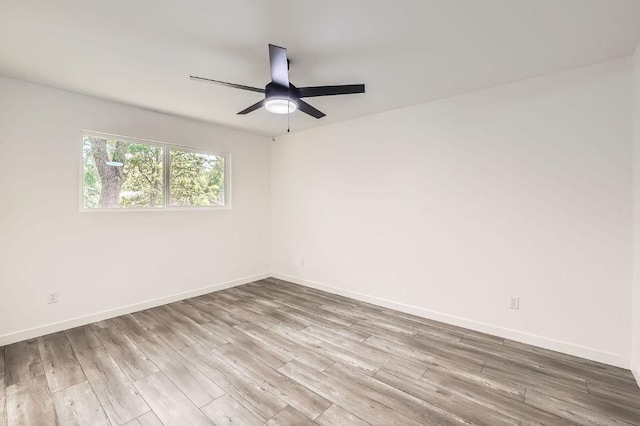 7103 Treasure Cv Unit B, Austin, TX 78745 - empty room featuring wood finished floors, ceiling fan, and baseboards