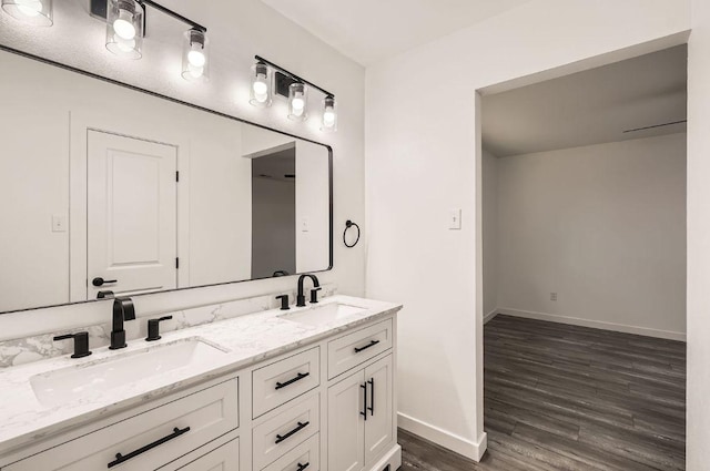 7103 Treasure Cv Unit B, Austin, TX 78745 - bathroom featuring double vanity and wood finished floors
