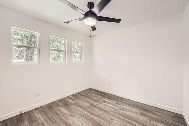 7103 Treasure Cv Unit B, Austin, TX 78745 - spare room featuring healthy amount of natural light, a ceiling fan, and wood finished floors