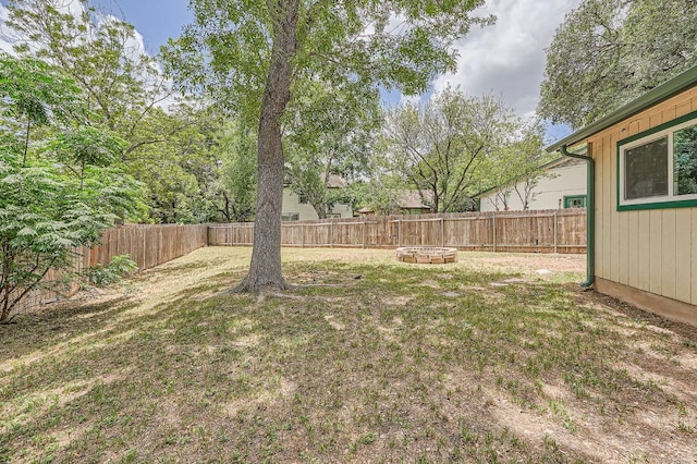 7103 Treasure Cv Unit B, Austin, TX 78745 - fenced backyard featuring a fire pit