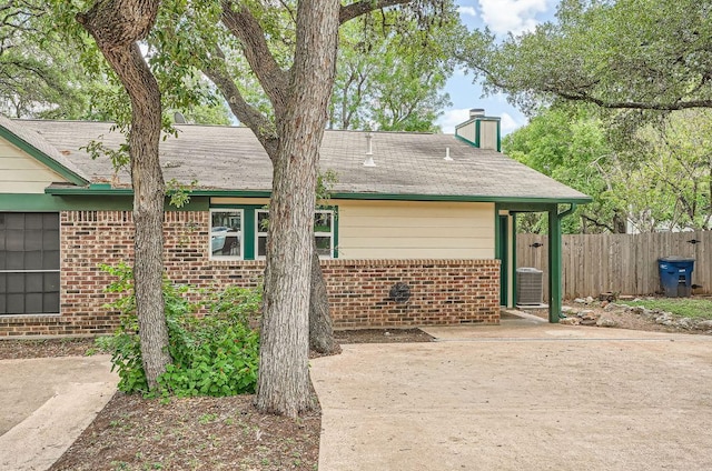 7103 Treasure Cv Unit B, Austin, TX 78745 - view of side of property with brick siding and a chimney