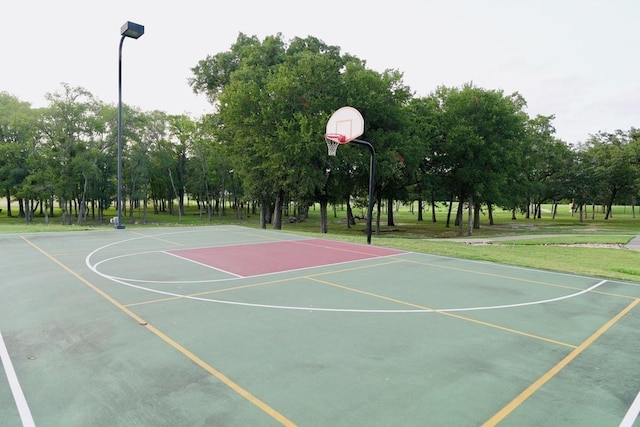 114 Loysoya St, Bastrop, TX 78602 - view of basketball court with community basketball court and view of wooded area