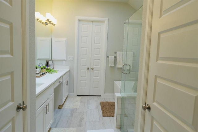 114 Loysoya St, Bastrop, TX 78602 - bathroom featuring double vanity, a stall shower, and a chandelier