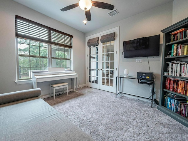 114 Loysoya St, Bastrop, TX 78602 - sitting room with a ceiling fan, french doors, and carpet