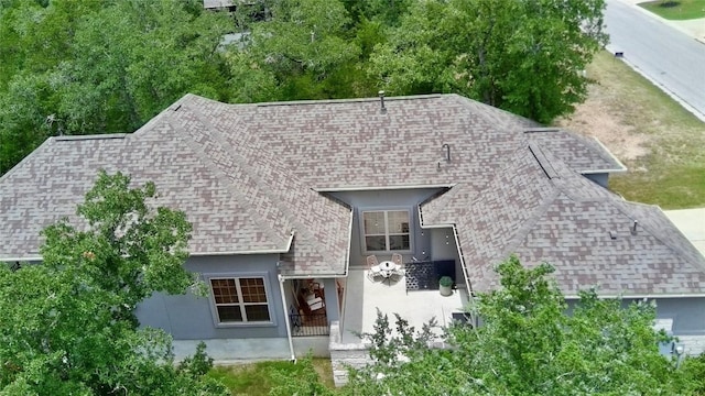 114 Loysoya St, Bastrop, TX 78602 - view of front of property with roof with shingles and stucco siding