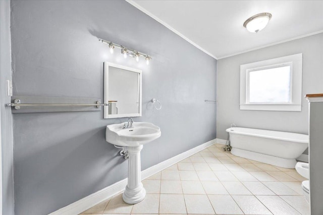 1223 Cecelia St, Taylor, TX 76574 - full bathroom featuring a soaking tub, crown molding, and tile patterned flooring