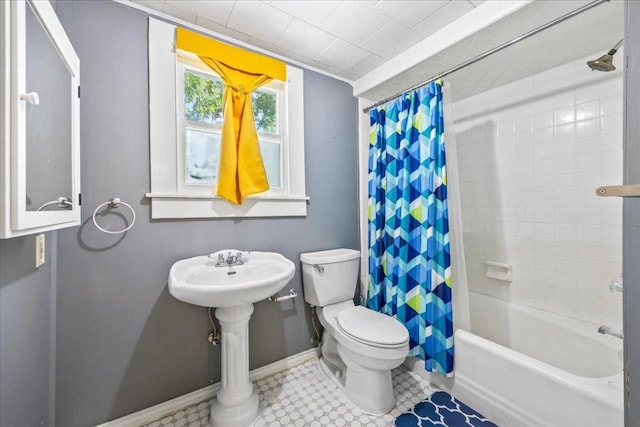 1223 Cecelia St, Taylor, TX 76574 - bathroom featuring toilet and shower / bath combo with shower curtain