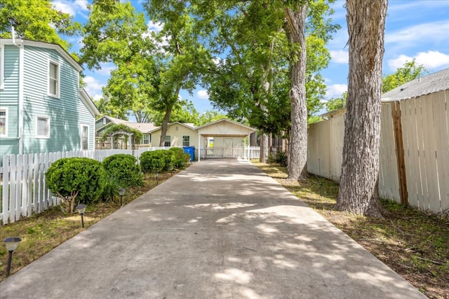 1223 Cecelia St, Taylor, TX 76574 - view of front of property with driveway and a gate
