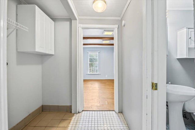 1223 Cecelia St, Taylor, TX 76574 - bathroom featuring tile patterned floors and crown molding