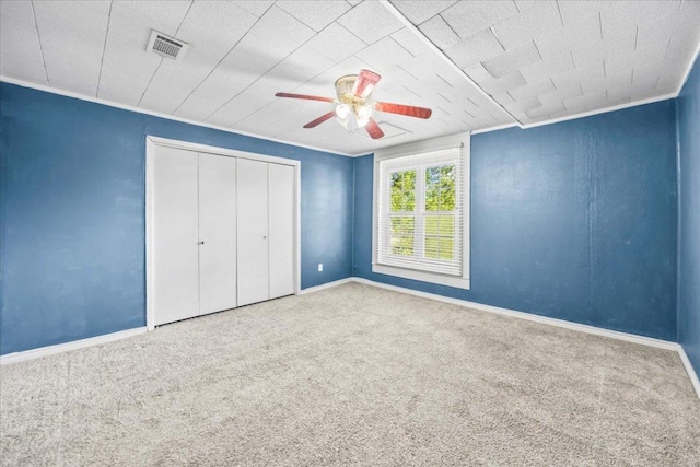 1223 Cecelia St, Taylor, TX 76574 - unfurnished bedroom featuring carpet flooring, a closet, and ceiling fan