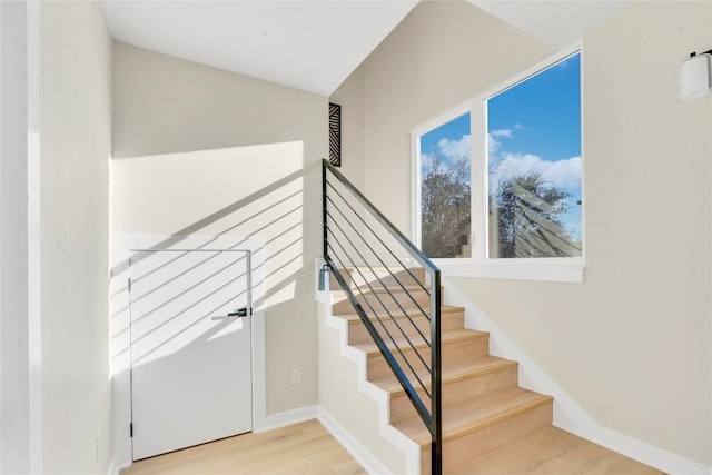 2309 Montopolis Dr Unit 8, Austin, TX 78741 - stairway featuring wood finished floors and baseboards