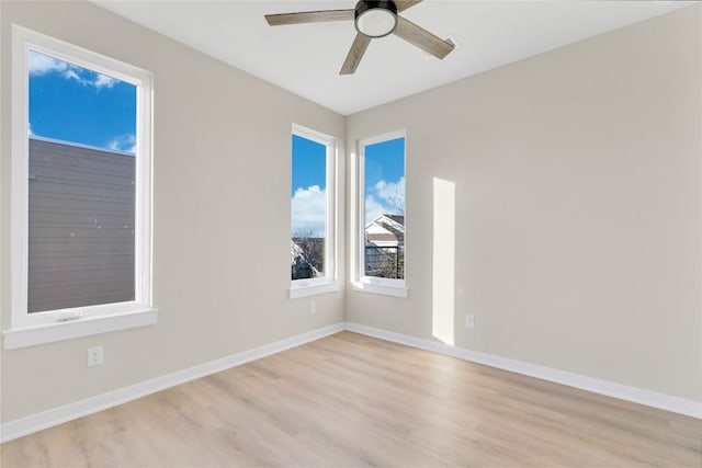 2309 Montopolis Dr Unit 8, Austin, TX 78741 - spare room with light wood-style floors and ceiling fan