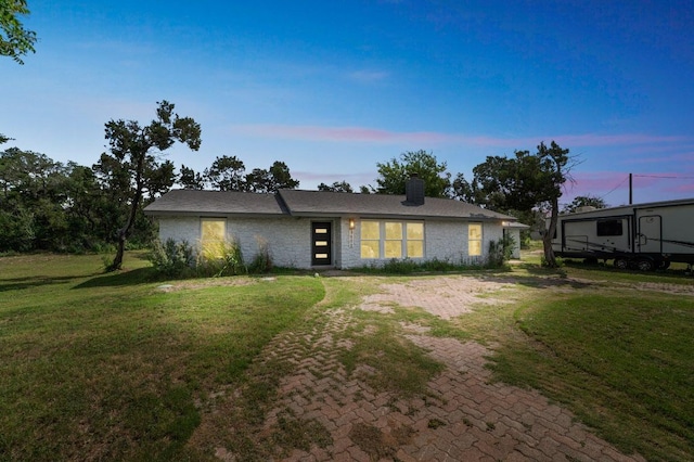 9600 Claxton Dr, Austin, TX 78736 - mid-century inspired home featuring a chimney and a lawn