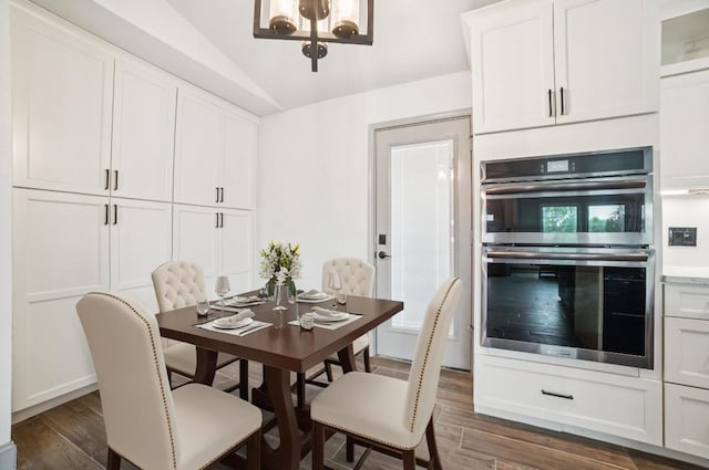 9600 Claxton Dr, Austin, TX 78736 - dining space featuring dark wood-type flooring, lofted ceiling, and a chandelier