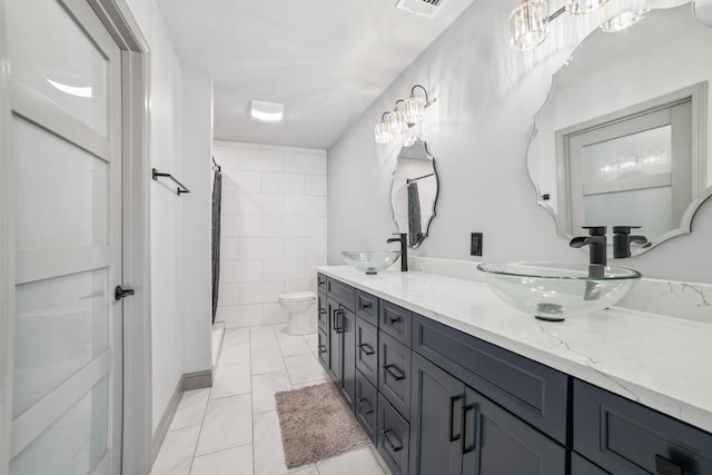 9600 Claxton Dr, Austin, TX 78736 - full bath with toilet, double vanity, and curtained shower
