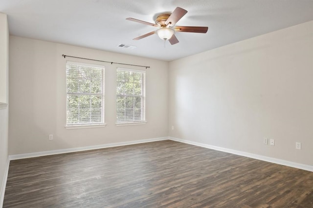 383 Spring Dr, Kyle, TX 78640 - empty room featuring dark wood-style floors, a ceiling fan, and baseboards