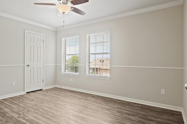 383 Spring Dr, Kyle, TX 78640 - unfurnished room featuring wood finished floors, baseboards, a ceiling fan, and crown molding